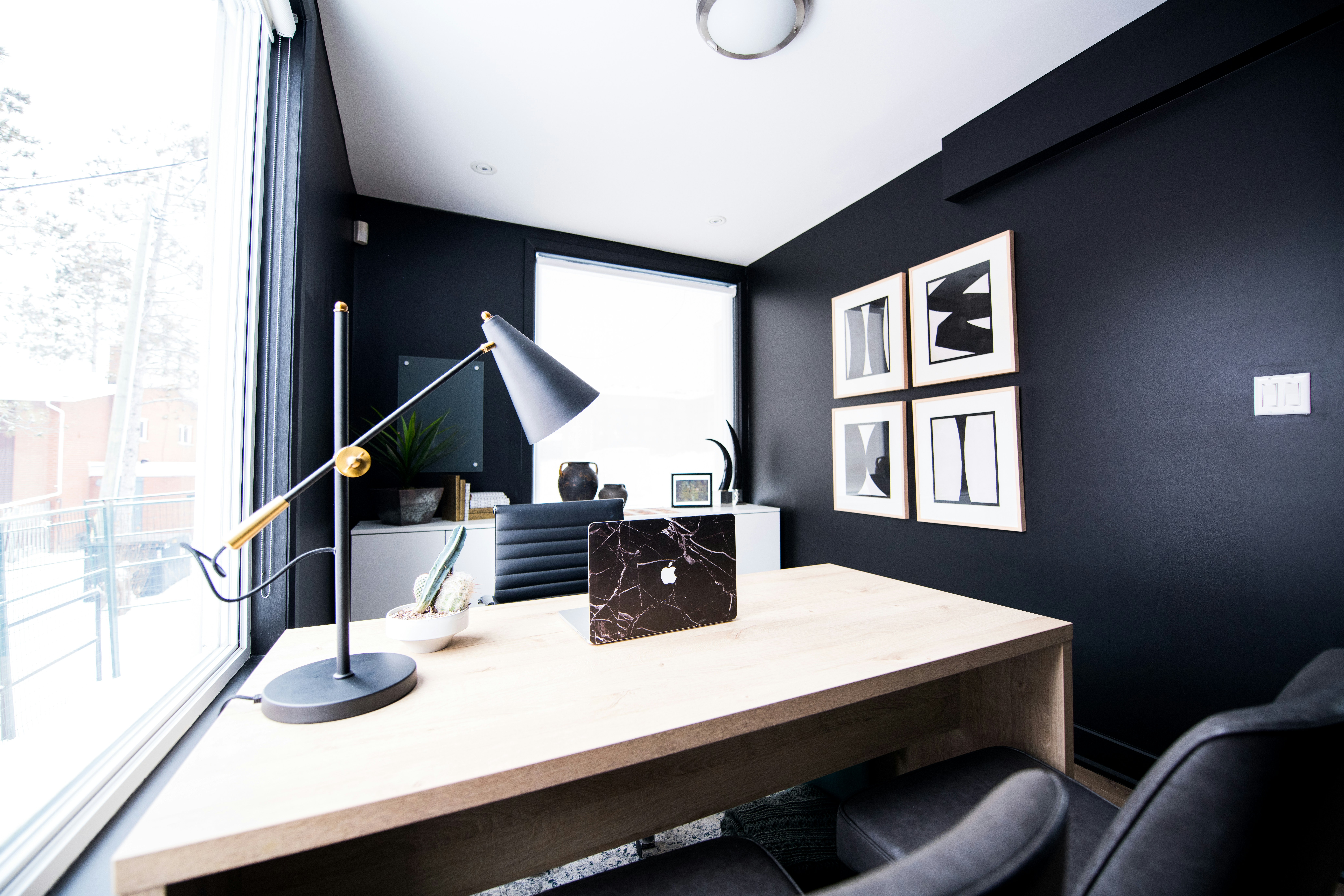 Dark contemporary workspace with desk lamp