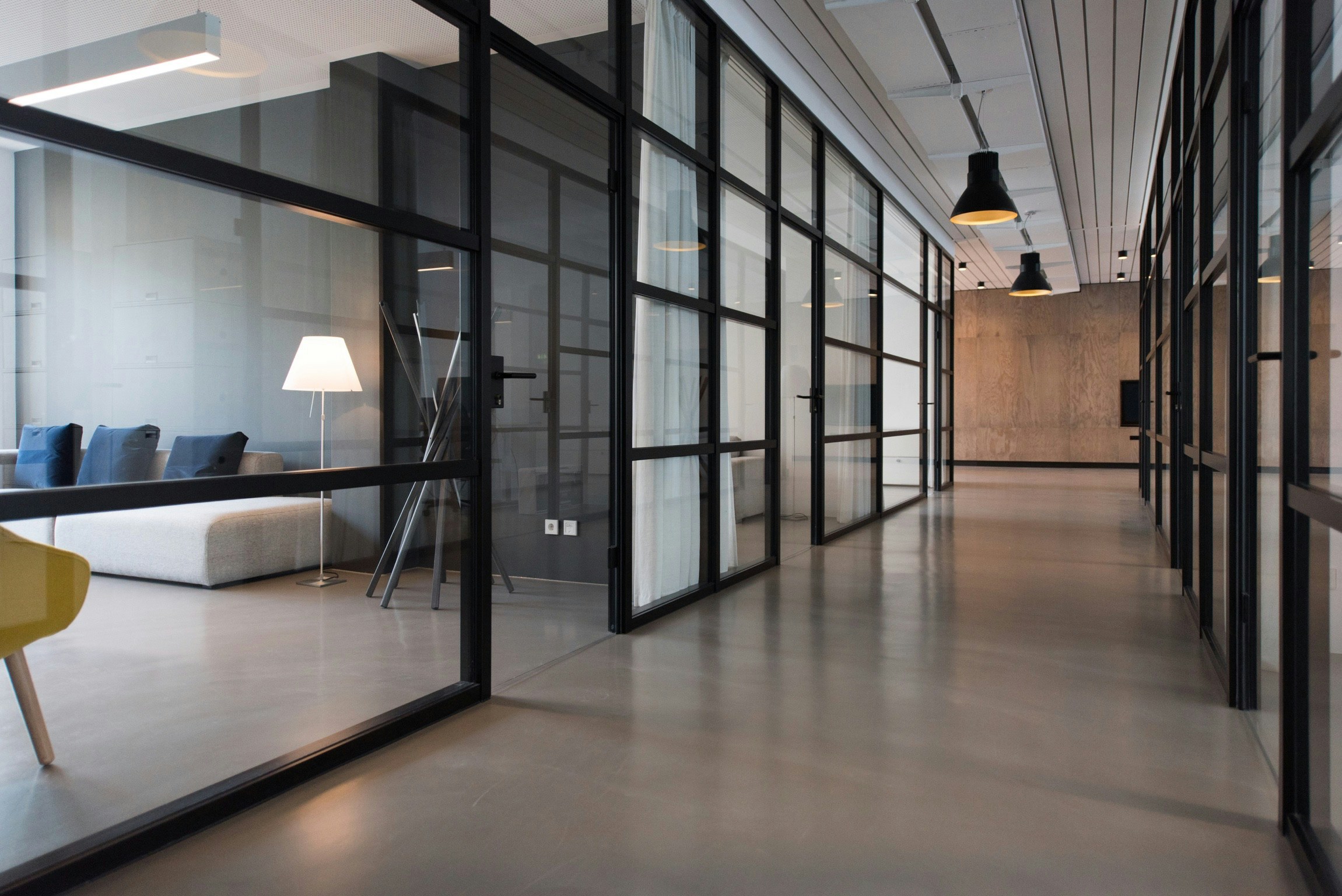 Modern office corridor with glass walls